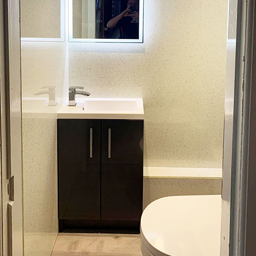 Small bedroom cupboard transformation into cloakroom toilet